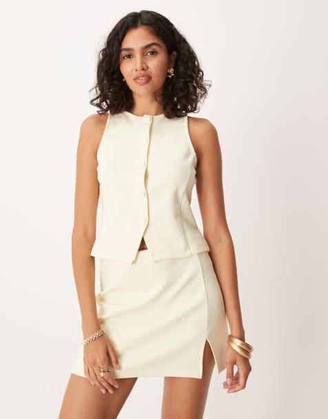ASOS DESIGN - Co-ord set van gilet met halternek en knoopsluiting en mini rok in lichtgeel - view 1