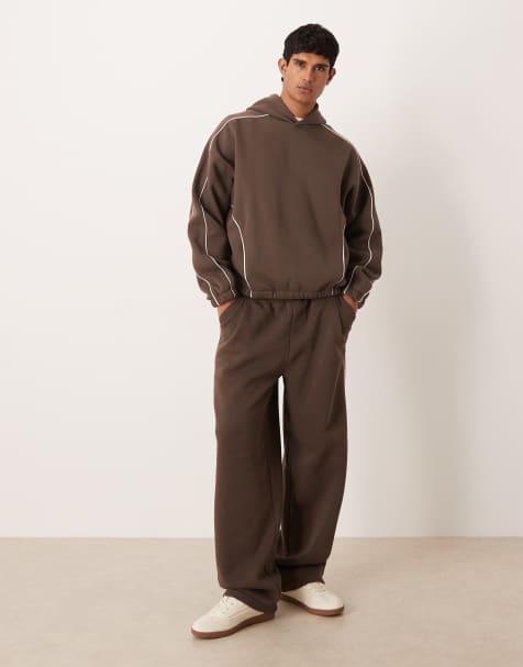ASOS DESIGN - Co-ord set van super baggy joggingbroek en hoodie met biezen aan de zijkant in bruin - view 1