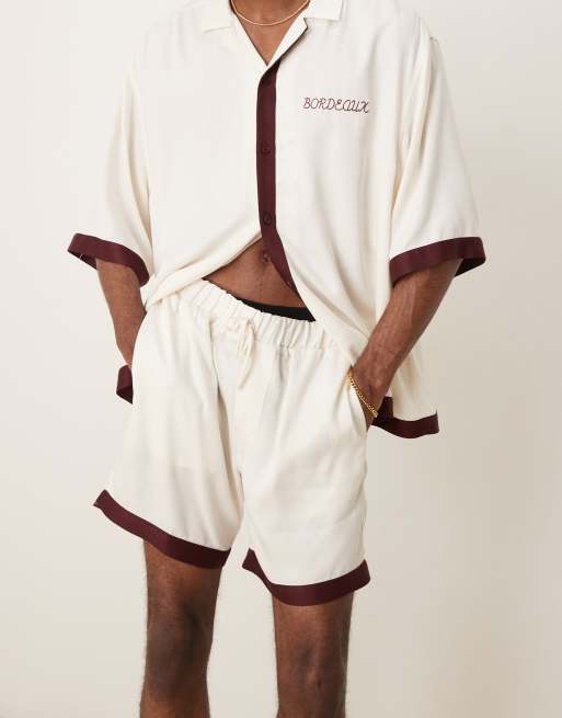 ASOS DESIGN co-ord shorts in mid length with border print in beige, 4 of 4