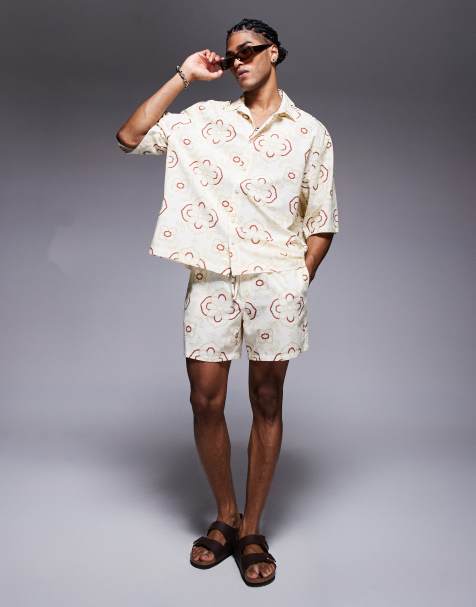 ASOS DESIGN co-ord shorts in mid length with geo print in beige