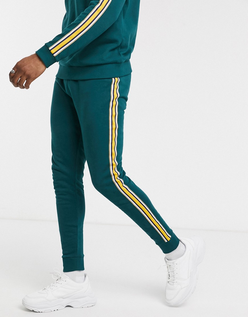 ASOS DESIGN co-ord skinny joggers in teal with side tape-Green