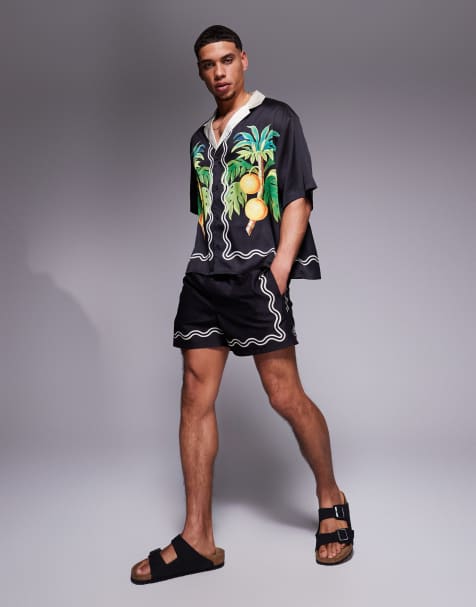 ASOS DESIGN co-ord swim shorts in short length with border print in black - view 1