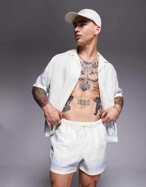ASOS DESIGN co-ord swim shorts in short length with border print in white - view 1