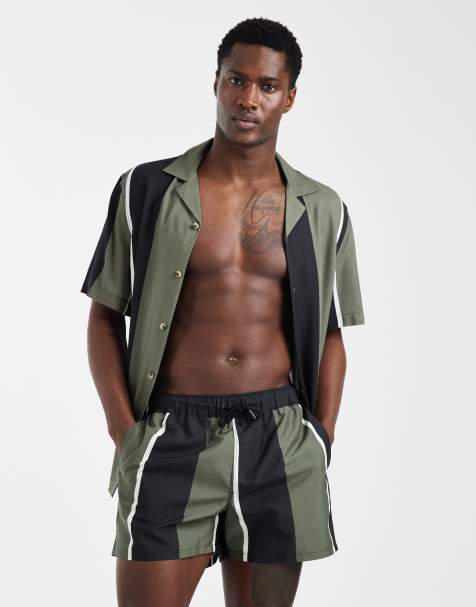 ASOS DESIGN co-ord swim shorts in short length with khaki and black stripe - view 1