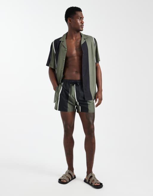 ASOS DESIGN co-ord swim shorts in short length with khaki and black stripe, 2 of 5