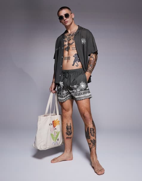 ASOS DESIGN co-ord swim shorts in short length with summer graphic in green - view 1