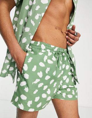 ASOS DESIGN co-ord swim shorts with polka dot print in khaki short length