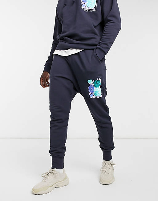 Men co-ord tapered joggers in navy with flower print 