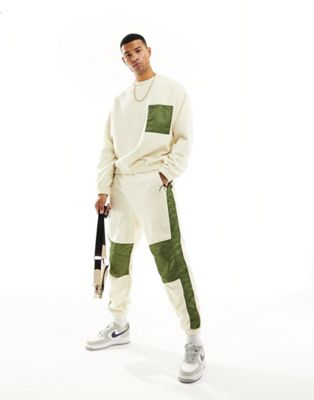 ASOS DESIGN co-ord tapered joggers in off white polar fleece with nylon detailing