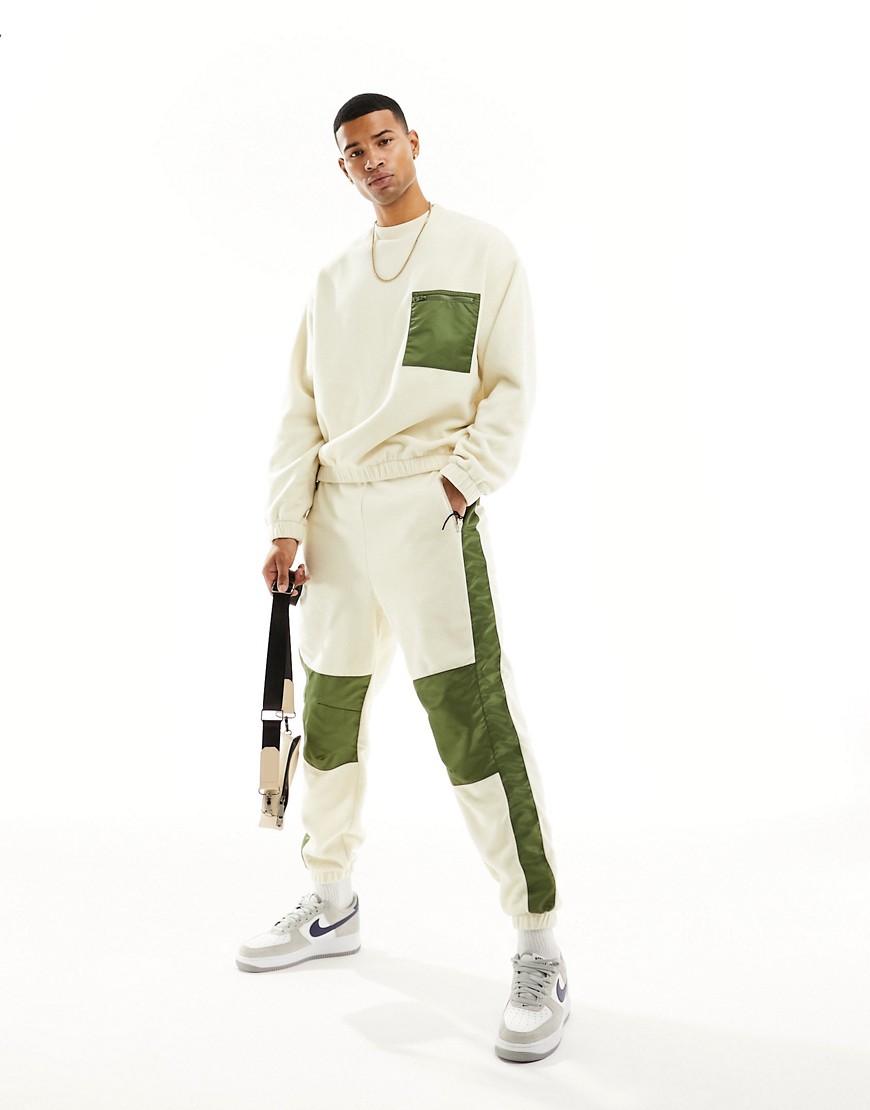ASOS DESIGN co-ord tapered joggers in off white polar fleece with nylon detailing