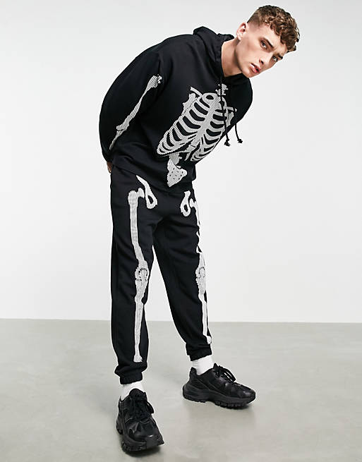 ASOS DESIGN co-ord tapered joggers with Halloween skeleton print in black