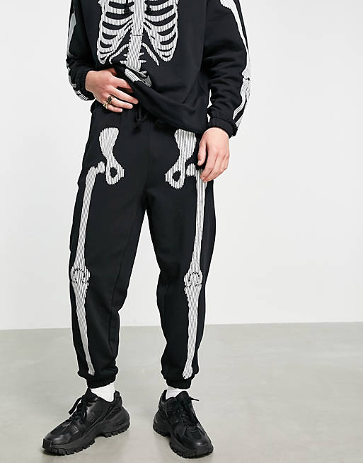 studie Savvy Overflod ASOS DESIGN co-ord tapered joggers with Halloween skeleton print in black |  ASOS