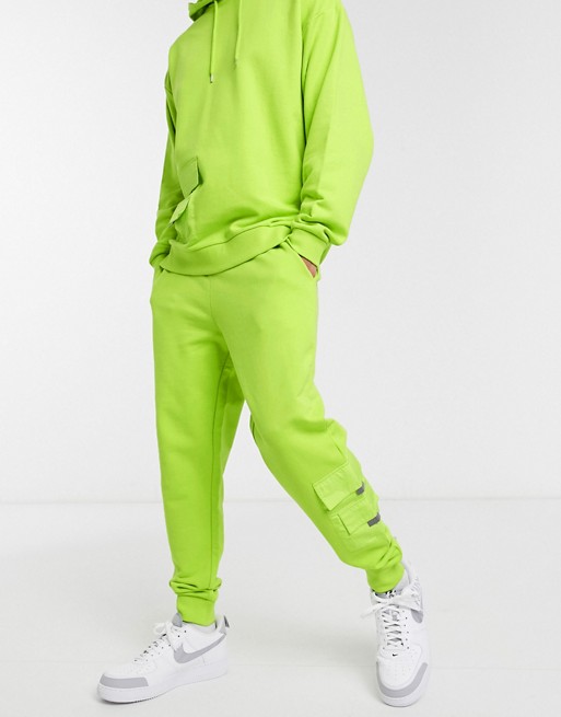 ASOS DESIGN co-ord tapered joggers with woven pockets & reflective details in acid green