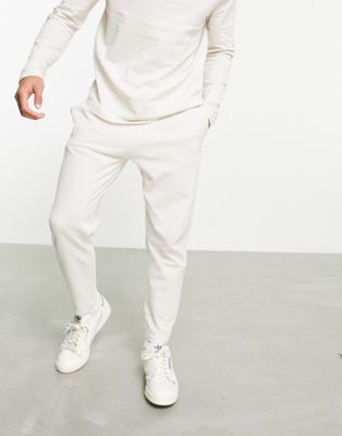 ASOS DESIGN co-ord tapered pique joggers with fixed hem & pin tucks in beige