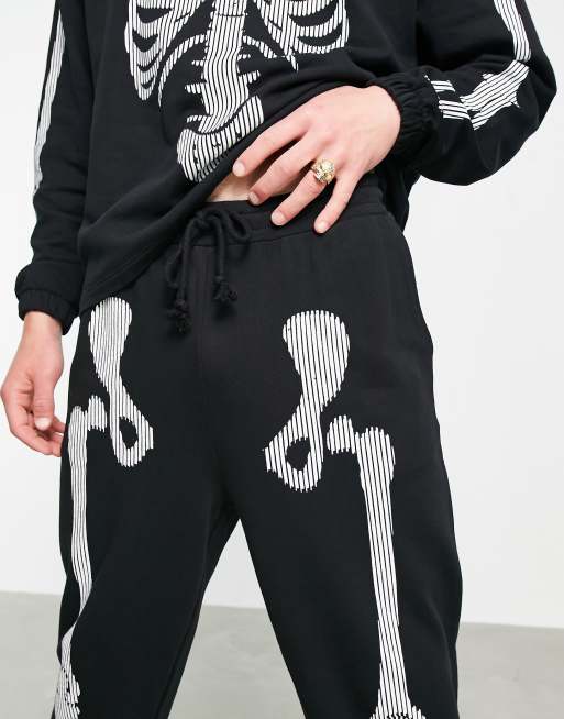 ASOS DESIGN co-ord tapered trackies with Halloween skeleton print in black, 3 of 4