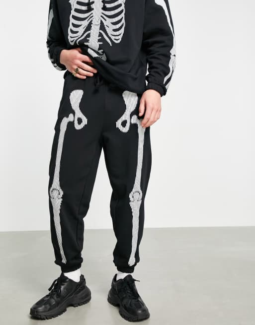 ASOS DESIGN co-ord tapered trackies with Halloween skeleton print in black, 4 of 4