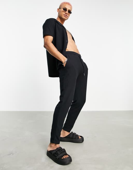 ASOS DESIGN co-ord waffle tapered joggers in black with fixed hem