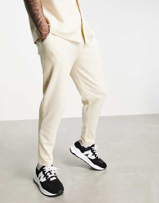 ASOS DESIGN co-ord waffle tapered joggers in cream with fixed hem