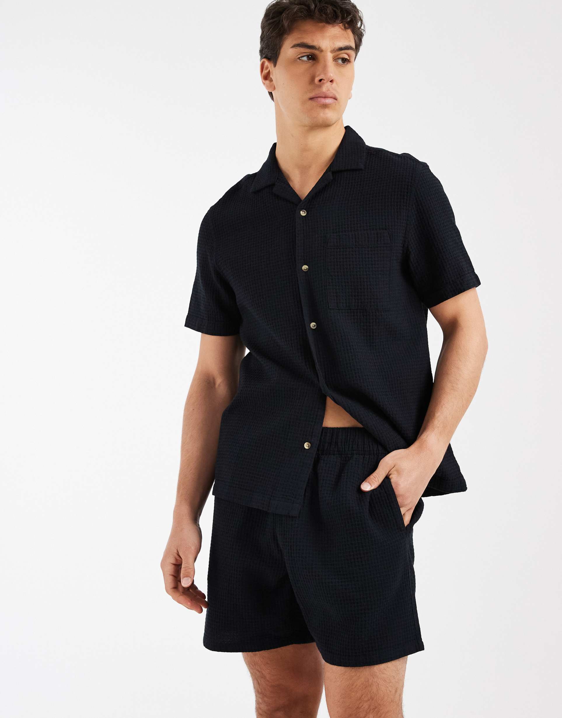 ASOS DESIGN co-ord waffle textured mid length shorts in black