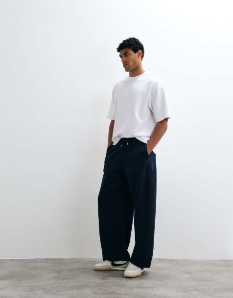 ASOS DESIGN cocoon barrel trackies in navy - view 1