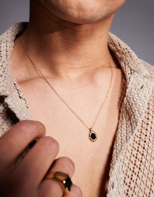 ASOS DESIGN - Collana con catenina dorata in acciaio inossidabile resistente all'acqua con pendente ovale nero