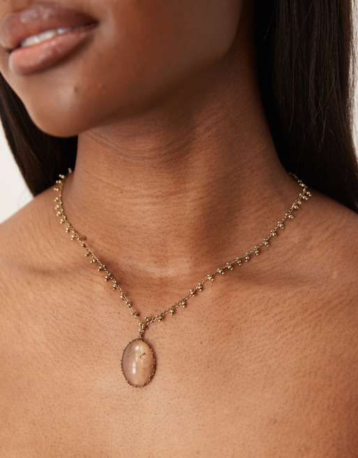 ASOS DESIGN - Collana dorata con ciondolo con quarzo sintetico