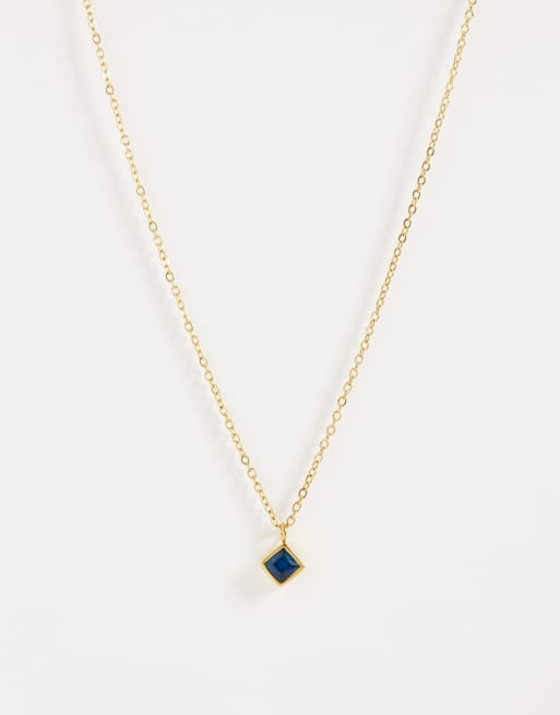 ASOS DESIGN - Collana in acciaio inossidabile resistente all'acqua dorata con zirconia cubica color zaffiro