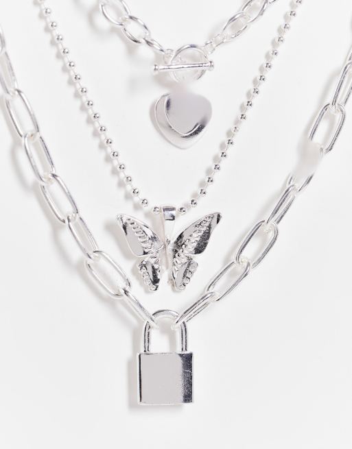 ASOS DESIGN - Collana multifilo color argento con ciondoli a farfalla e lucchetto in stile anni '90, 2 di 4