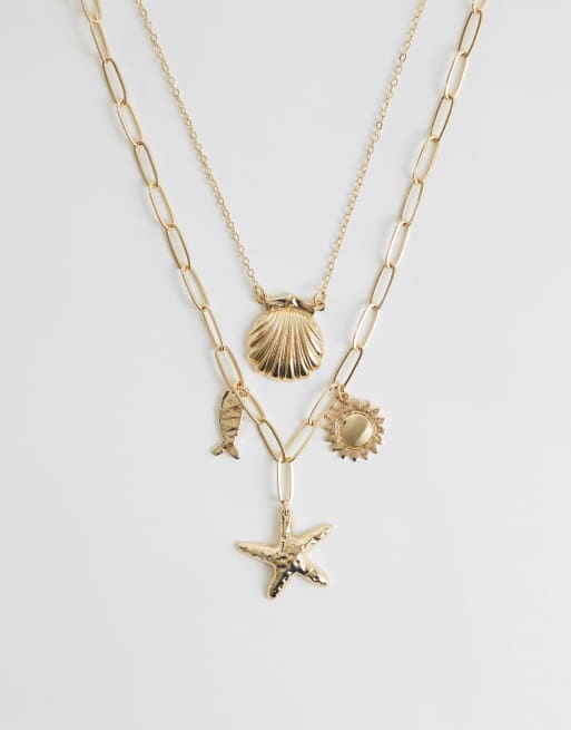 ASOS DESIGN - Collana multifilo color oro con ciondoli a tema marino