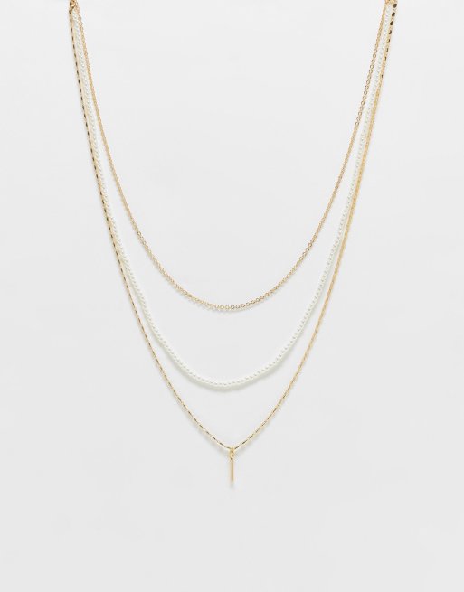 ASOS DESIGN - Collana multifilo color oro con perle piccole e pendente a barra