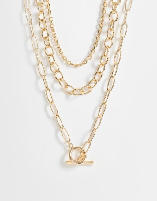 ASOS DESIGN - Collana multifilo con catenina grossa color oro con perle sintetiche e barretta
