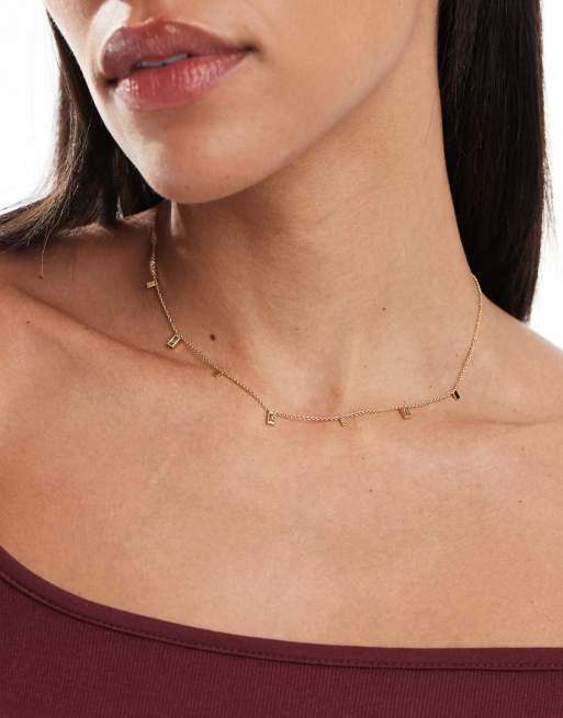 ASOS DESIGN - Collana placcata oro 14 k con charm in zirconia cubica con confezione regalo