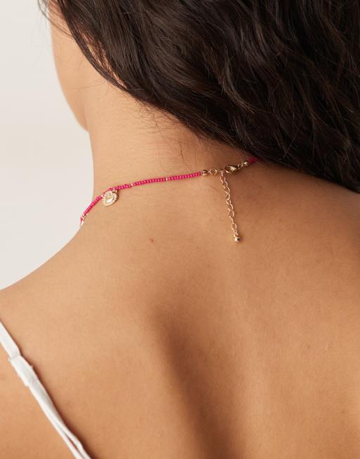 ASOS DESIGN - Collana rosa con perline e charm, 3 di 3
