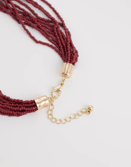 ASOS DESIGN - Collar dorado de varias hileras con cuentas burdeos y colgante de estrella de mar, 3 de 4