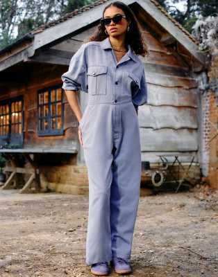 ASOS DESIGN collared boilersuit with button detail leg in blue