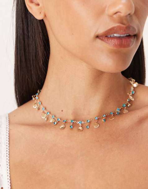 ASOS DESIGN - Collier à petits détails coquillage dorés et strass bleus - view 1