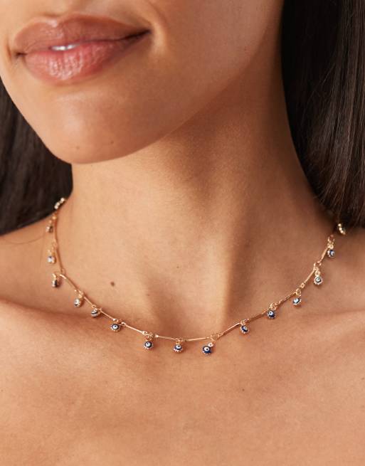 ASOS DESIGN - Collier en maille pointillé dorée à yeux bleus