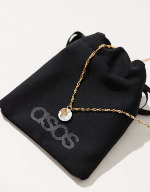 ASOS DESIGN - Collier en plaqué or 14 carats à pendentif disque en perle fantaisie et symbole signe astrologique Bélier avec pochette cadeau