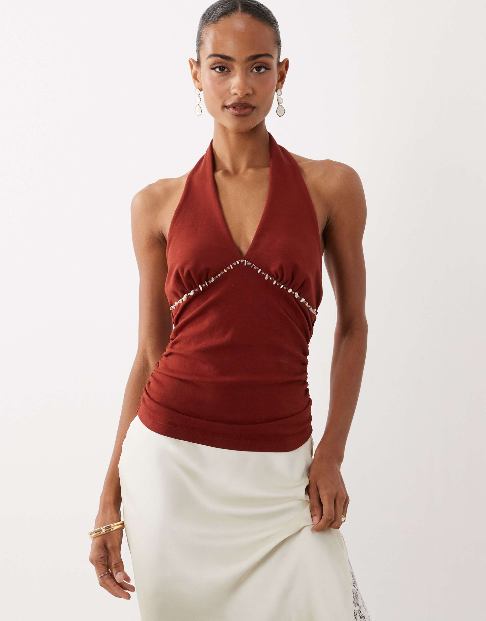 asos design compact cotton blend ruched halter neck top with beaded detailing in rust red