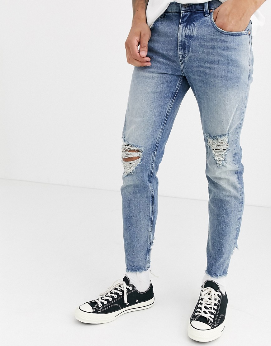 ASOS DESIGN – Cone Mill Denim – Ljusa vintagetvättade American Classic skinny jeans med revor och råskuren fåll-Blå