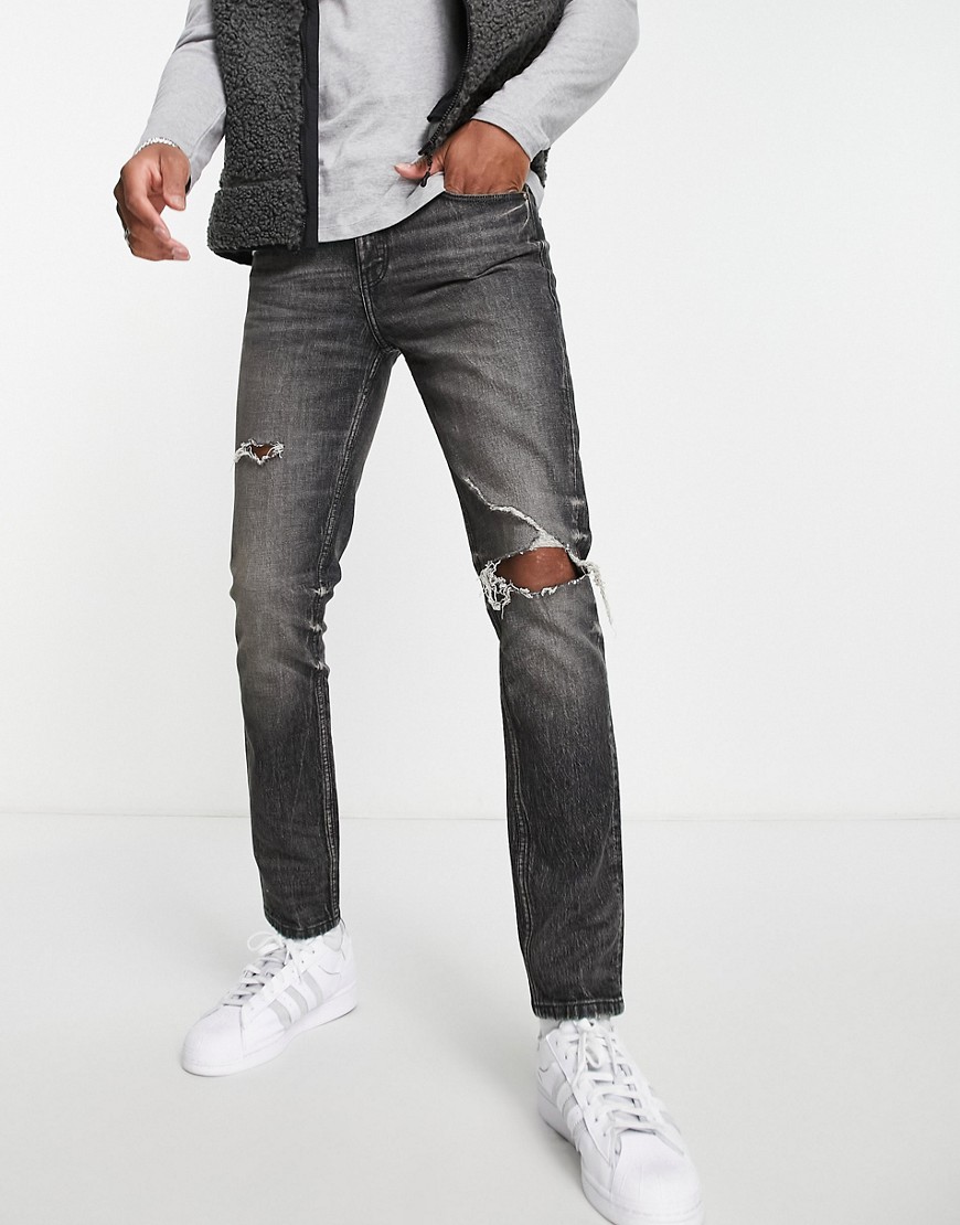 ASOS DESIGN Cone Mill Denim skinny 'American classic' jeans in washed black with knee rip