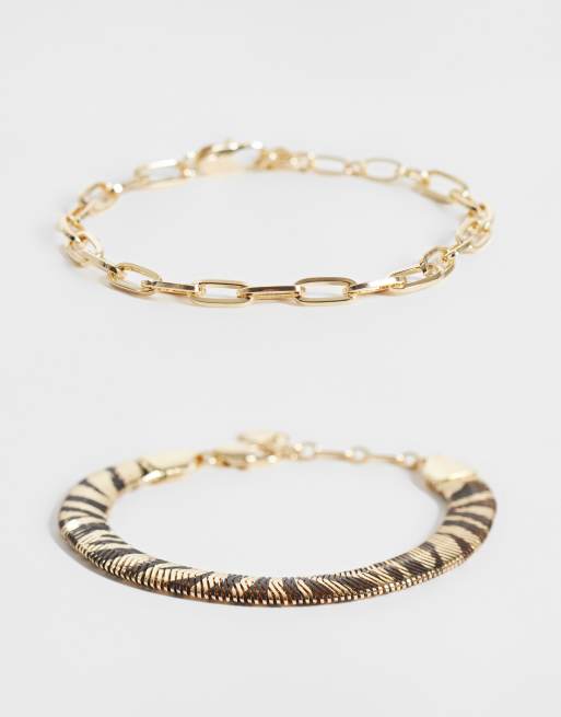 ASOS DESIGN confezione da 2 bracciali con stampa zebra color oro, 1 di 3