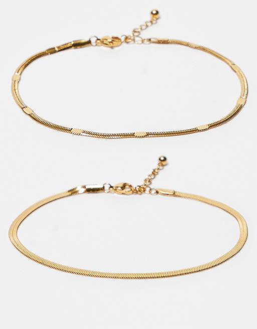 ASOS DESIGN - Confezione da 2 cavigliere in acciaio inossidabile resistente all'acqua tonalità oro con catenina snake