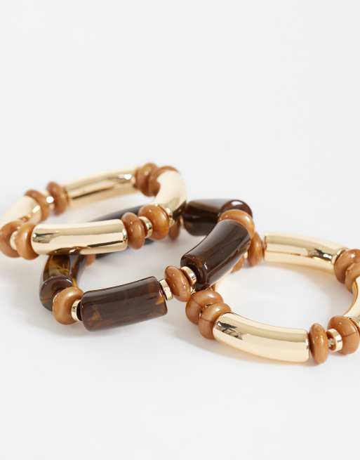 ASOS DESIGN - Confezione da 3 bracciali rigidi impilabili in tonalità marroni e bordeaux, 2 di 4