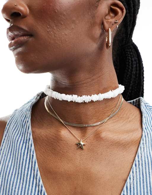 ASOS DESIGN - Confezione da 3 collane color oro, con ciondolo a stella marina e con frammenti di perle sintetiche