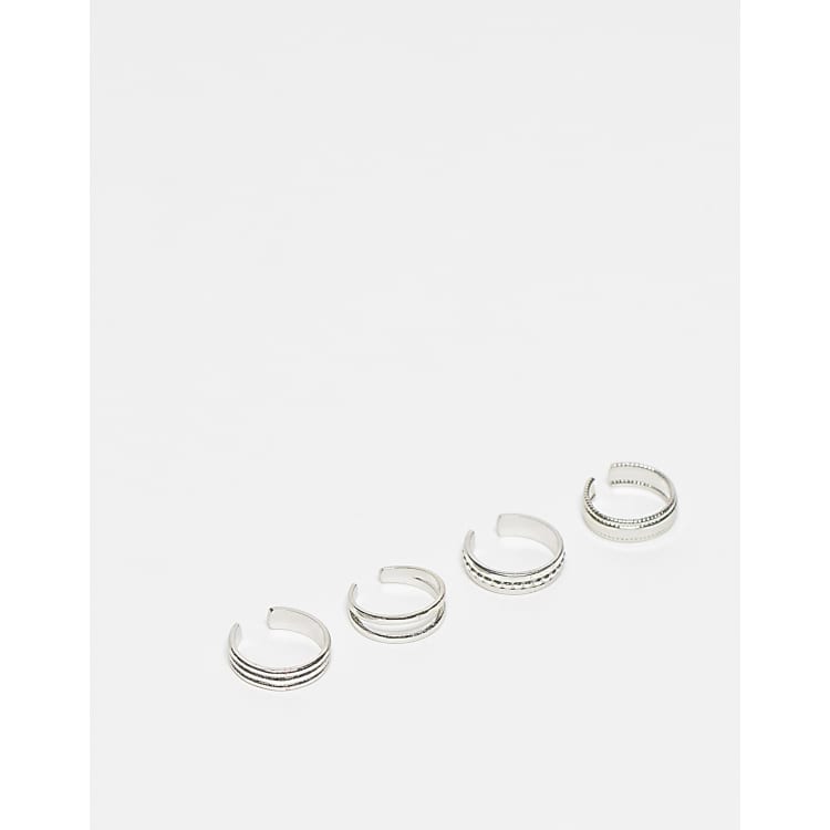 ASOS DESIGN Confezione da 4 anelli da piedi color argento con design misti