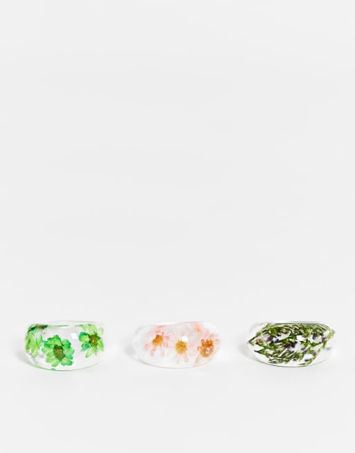 ASOS DESIGN - Confezione da tre anelli in plastica trasparente con fiori all'interno