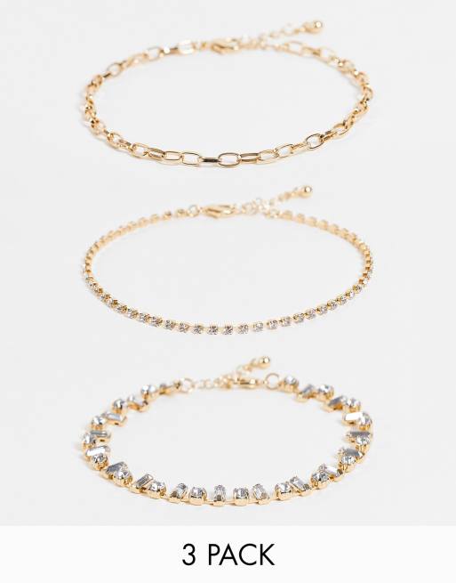 ASOS DESIGN - Confezione da tre cavigliere in catenina color oro con cristalli