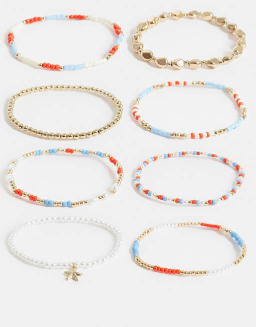 ASOS DESIGN - Confezione multipack di bracciali rigidi elasticizzati color oro e blu