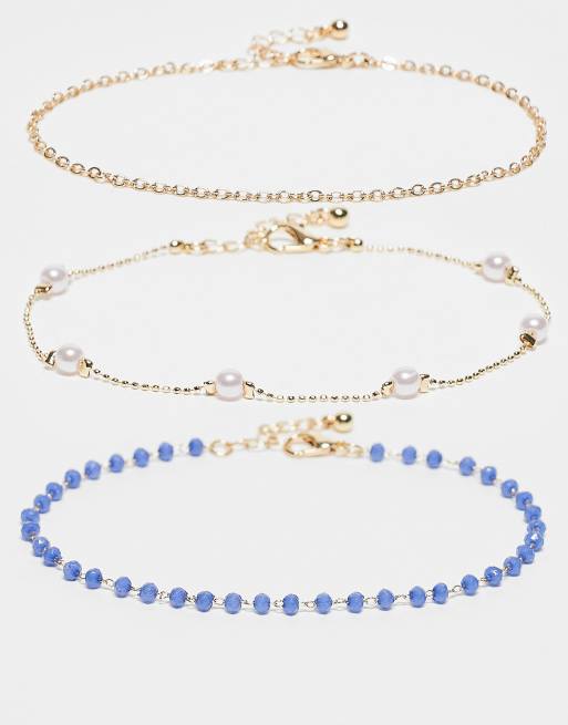 ASOS DESIGN - Confezione multipack di cavigliere color oro con perle sintetiche e perline blu